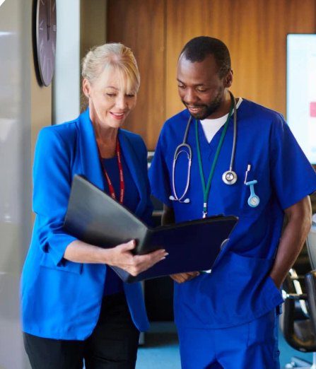 Doctor and nurse reviewing documents together