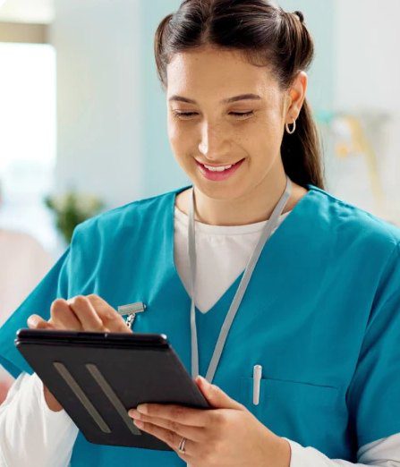 Medical worker reviewing information on a tablet
