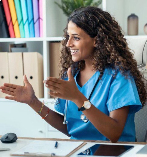 Nurse communicating at a desk