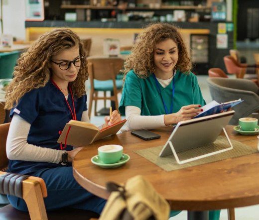 Nurses in scrubs studying together