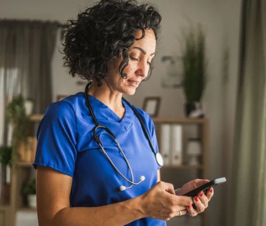 Nurse with stethoscope reviewing information